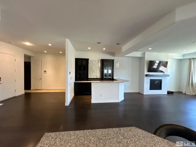 a kitchen with stainless steel appliances granite countertop a sink and cabinets