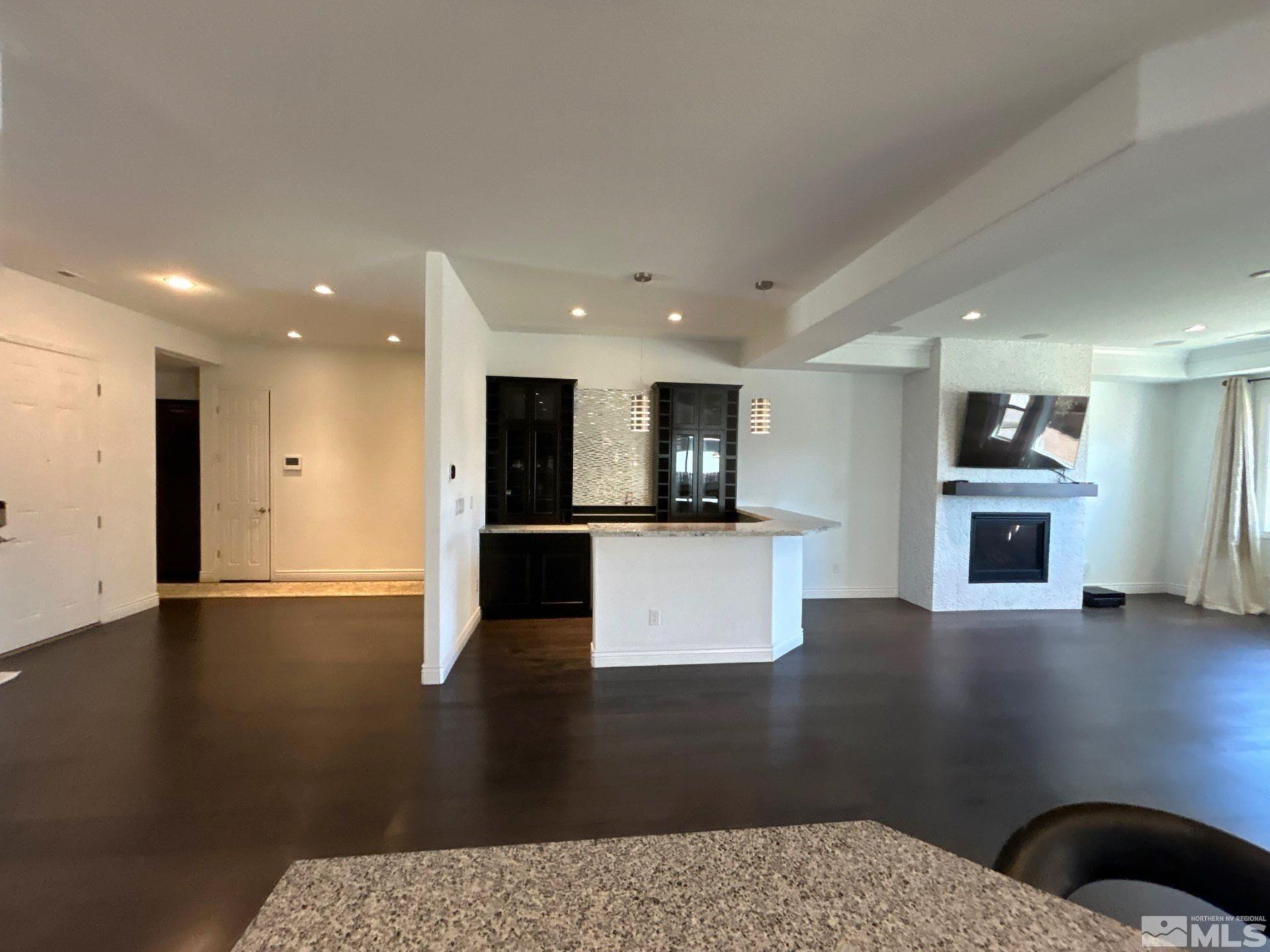 2070 Blue Boy Lane Reno, NV 89521 - Photo 12 of 31 a view of kitchen with stainless steel appliances wooden floor and living room