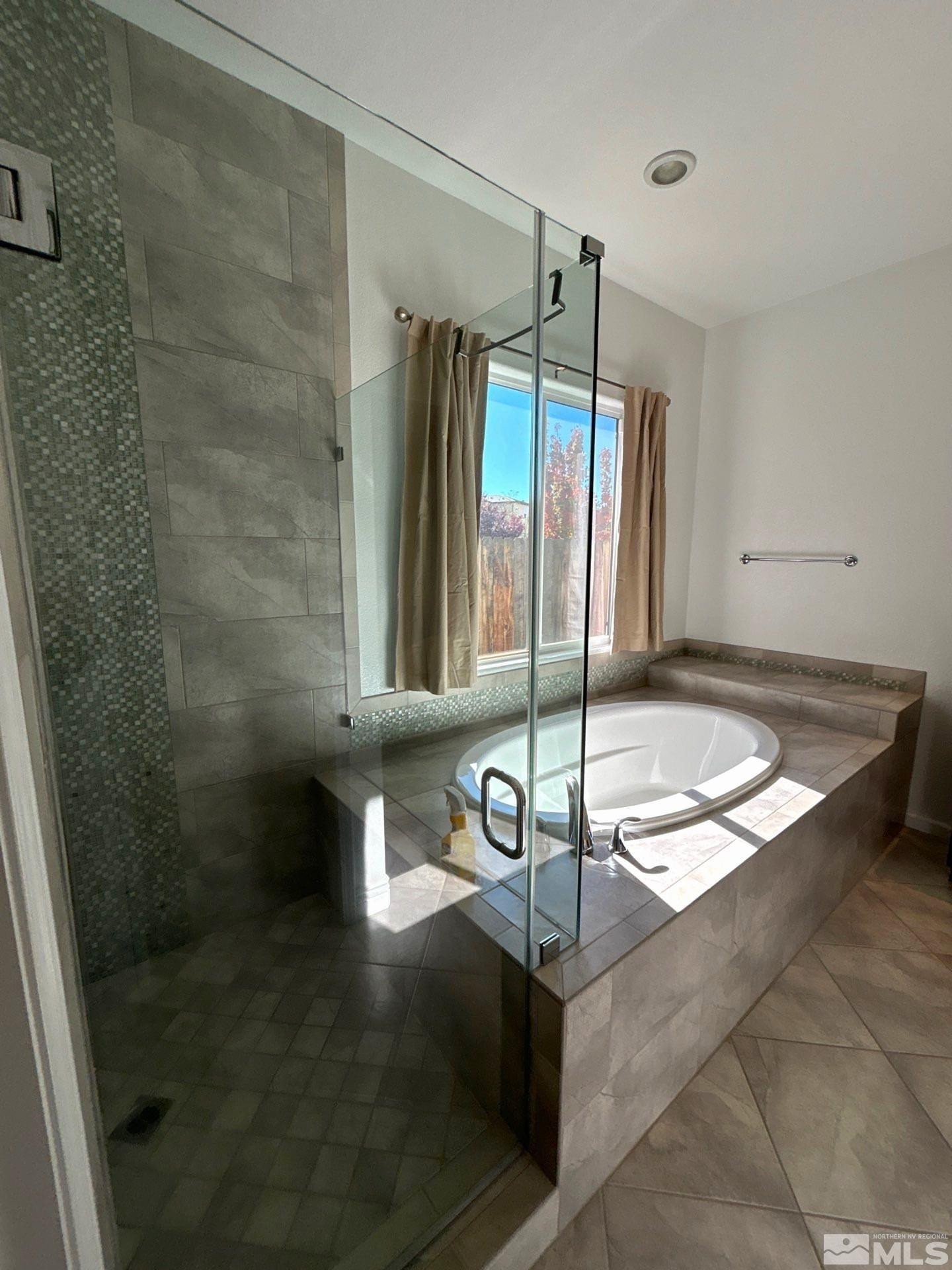 2070 Blue Boy Lane Reno, NV 89521 - Photo 19 of 31 a bathroom with a mirror and a shower