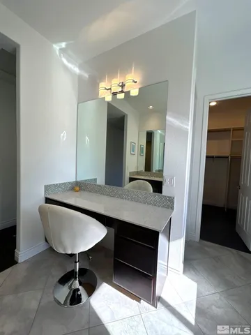 a dining room with a table and chairs