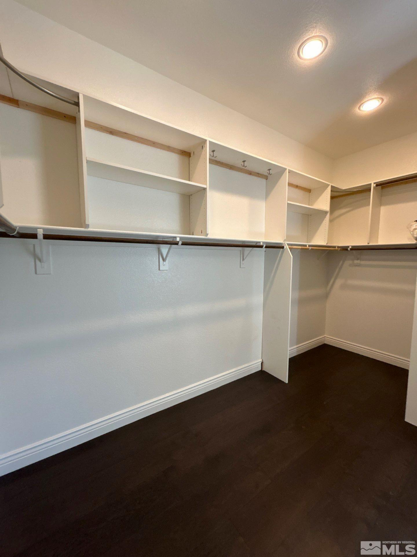 2070 Blue Boy Lane Reno, NV 89521 - Photo 22 of 31 a view of an empty room with wooden floor