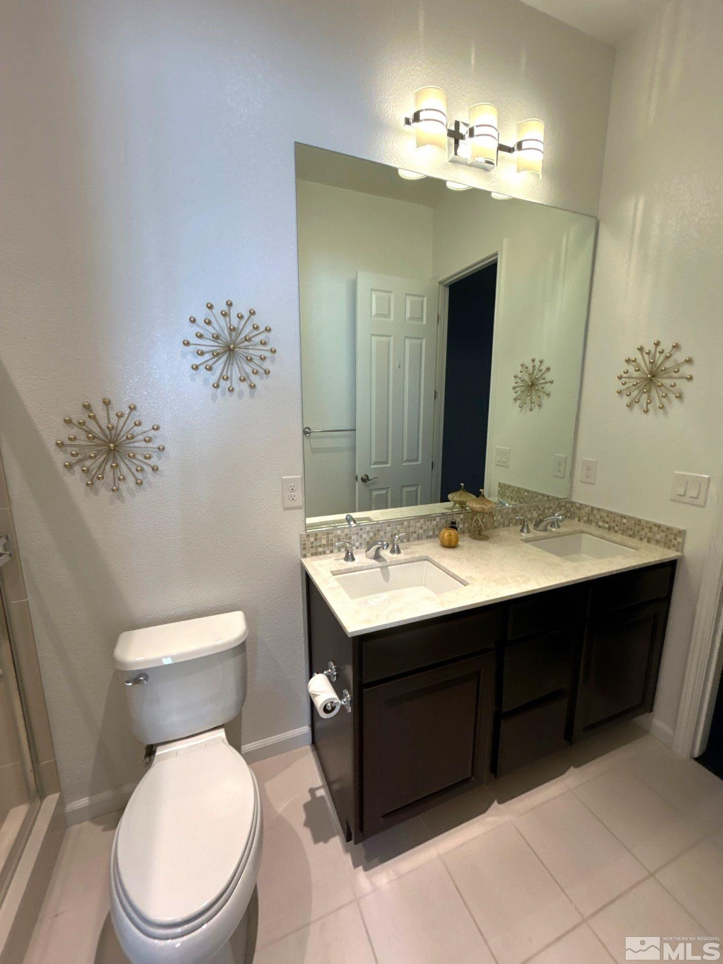 2070 Blue Boy Lane Reno, NV 89521 - Photo 24 of 31 a bathroom with a sink vanity and toilet