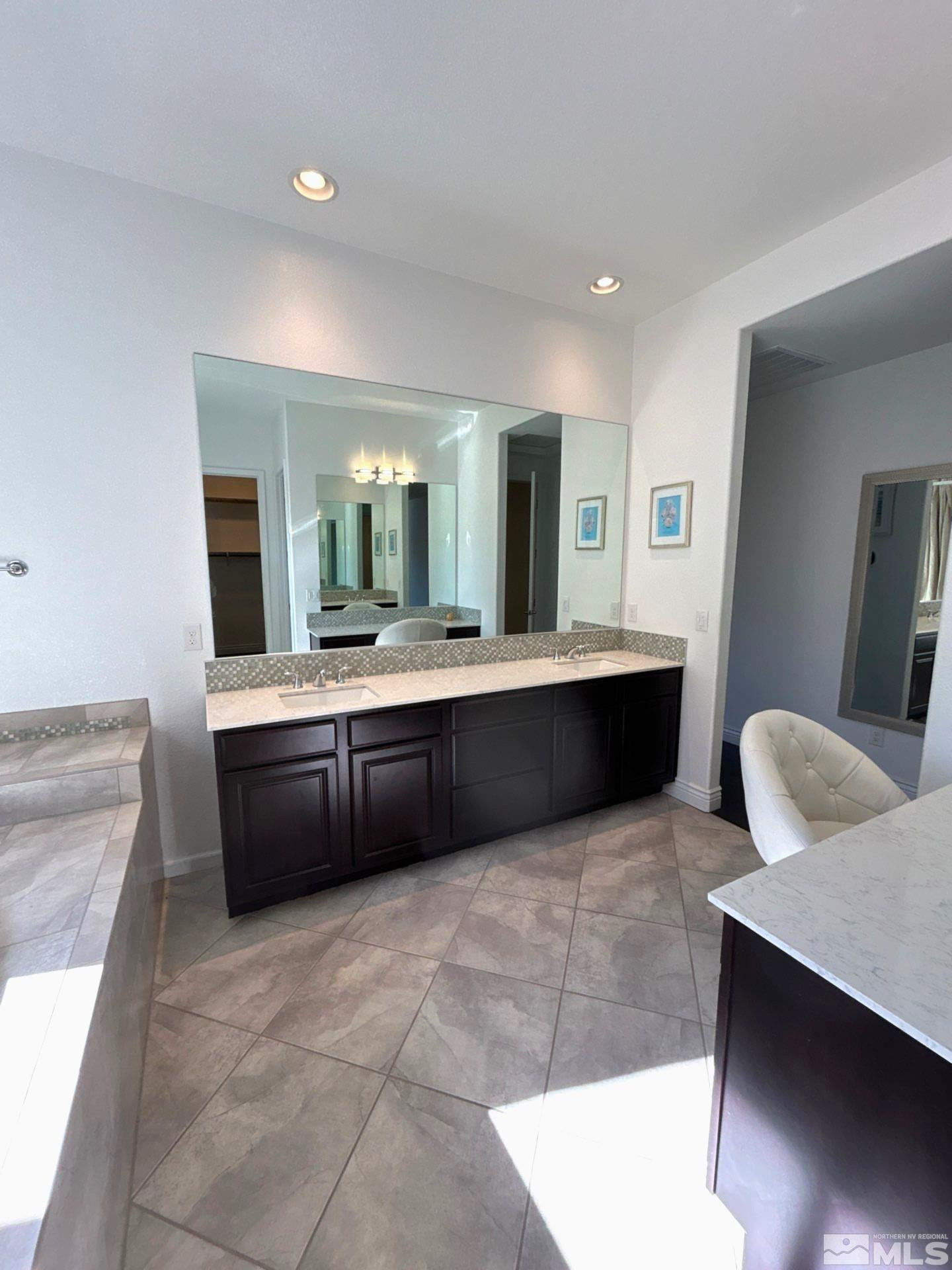 2070 Blue Boy Lane Reno, NV 89521 - Photo 29 of 31 a large bathroom with a large tub and sink