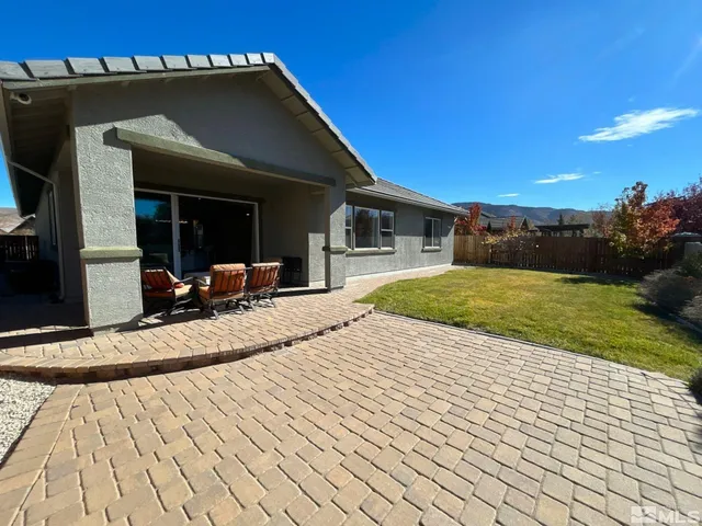 a view of a backyard of the house