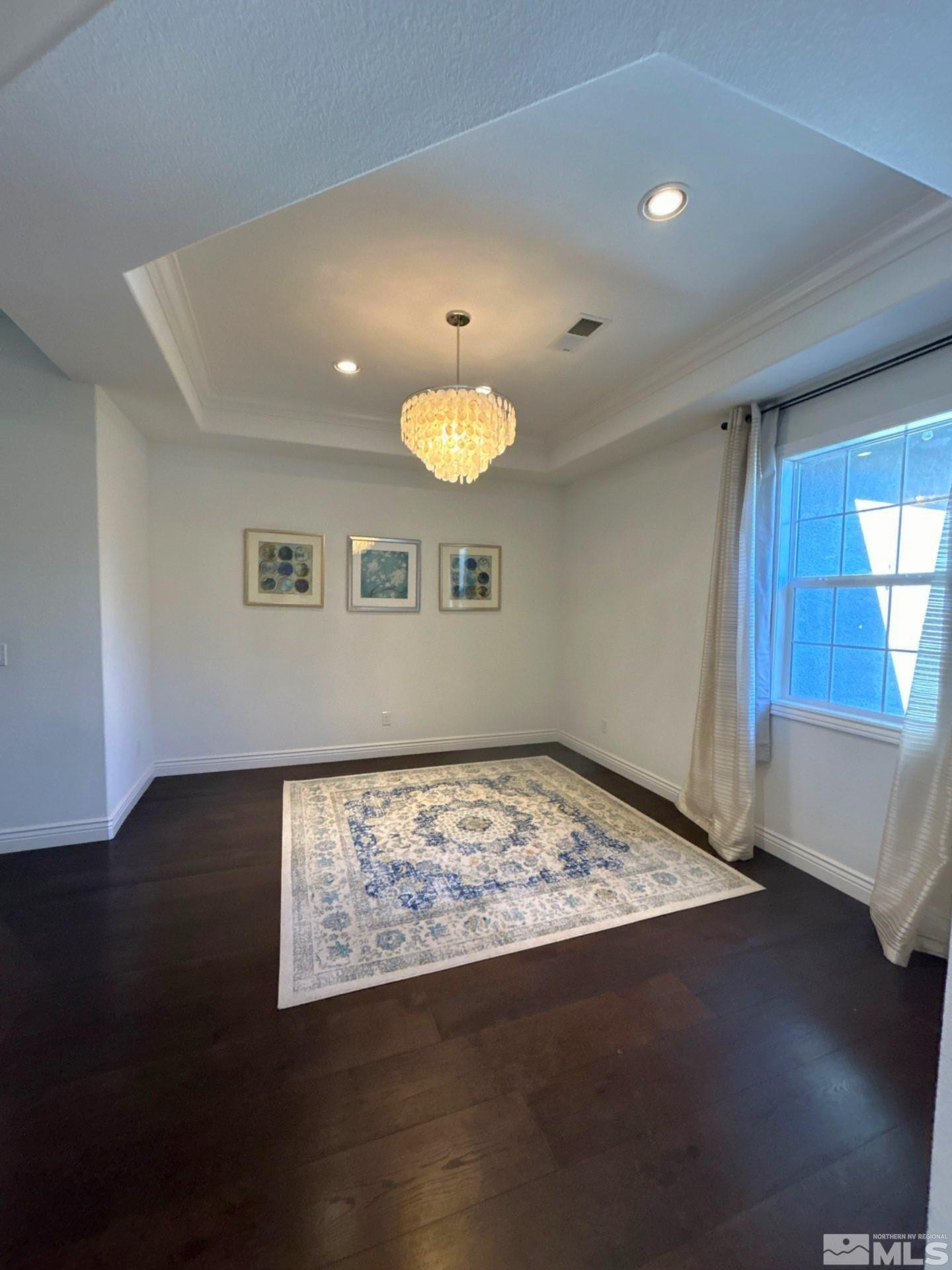 2070 Blue Boy Lane Reno, NV 89521 - Photo 6 of 31 a view of a room with wooden floor and a window