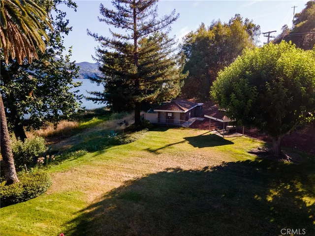 a view of a backyard with swimming pool