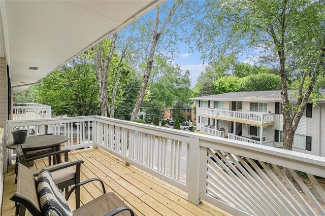 a view of a wooden chairs on deck