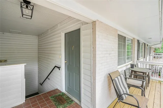 a view of a livingroom with furniture and windows
