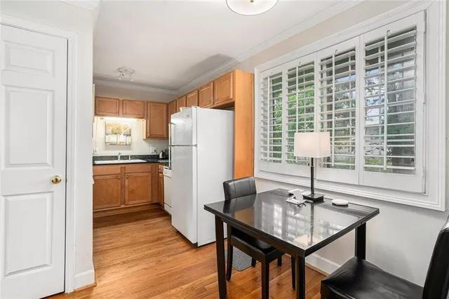a kitchen with a table and chairs