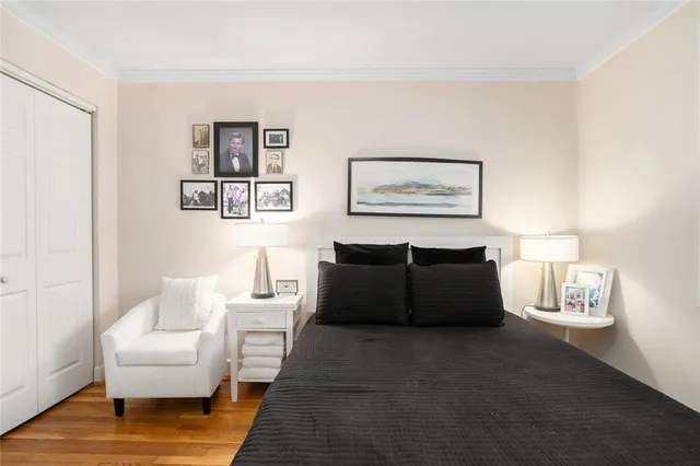 a living room with furniture and a painting on the wall