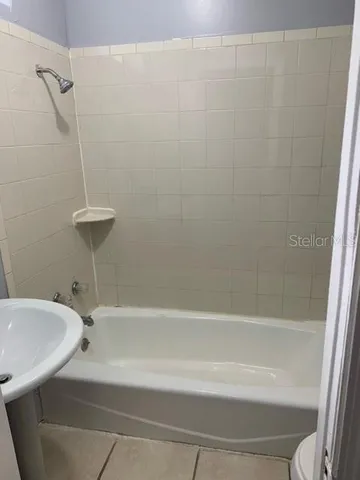 a bathroom with a sink and bathtub
