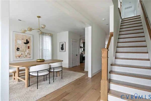 a dining room with furniture and window