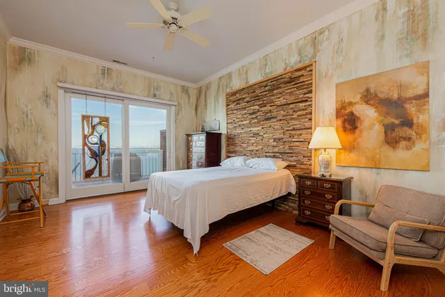 a bedroom with a bed and a couch