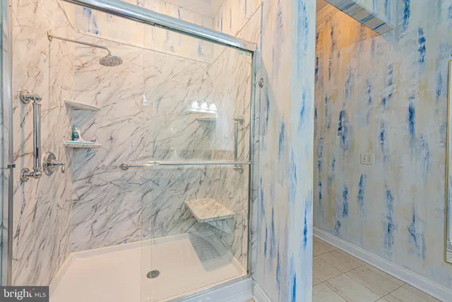 a bathroom with a bathtub and shower