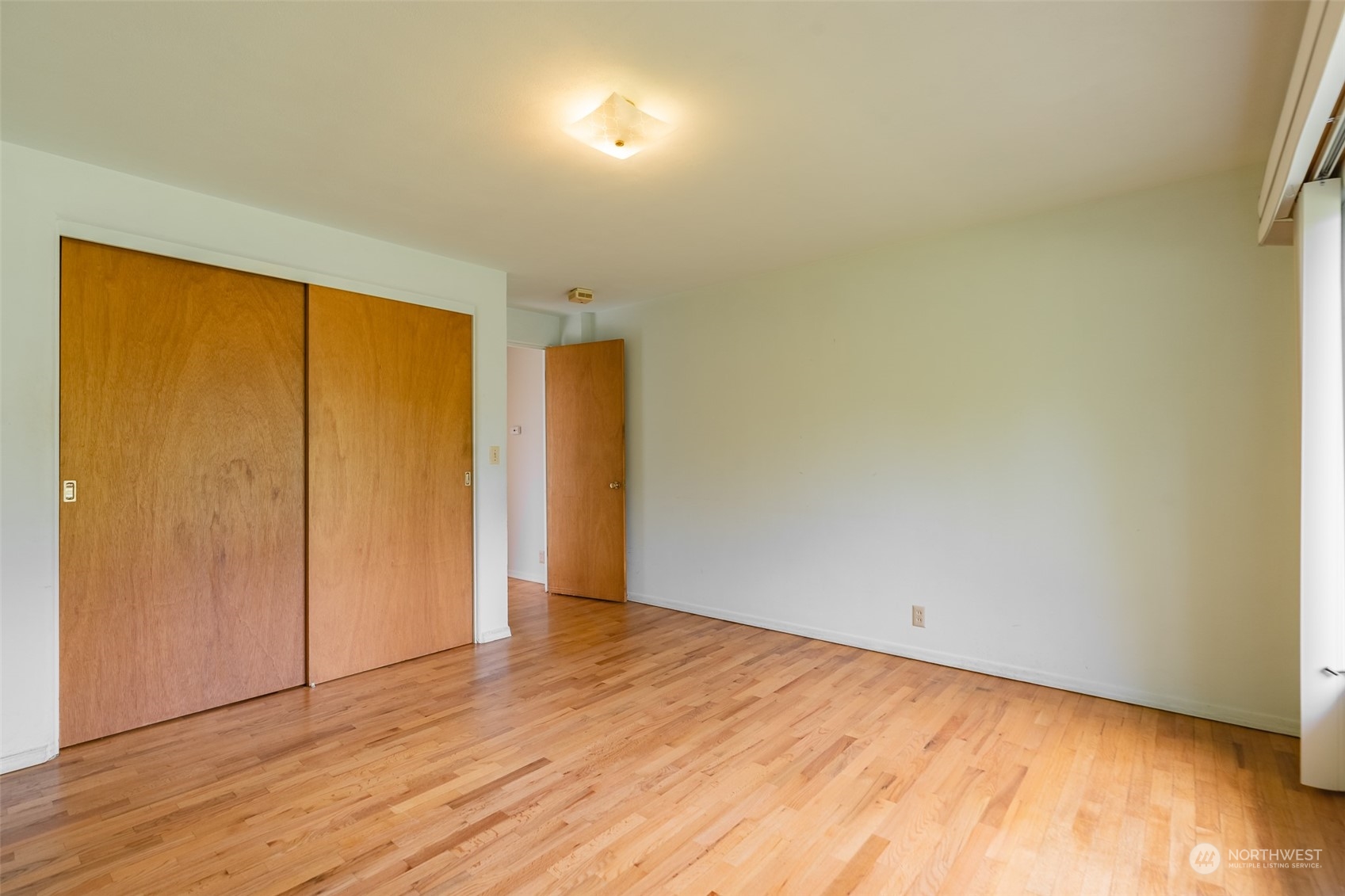 3326 Cedarville Road Bellingham, WA 98226 - Photo 11 of 40 an empty room with wooden floor and windows
