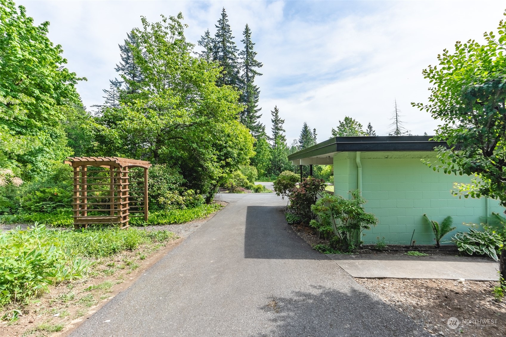 3326 Cedarville Road Bellingham, WA 98226 - Photo 24 of 40 a view of a garden with a fountain