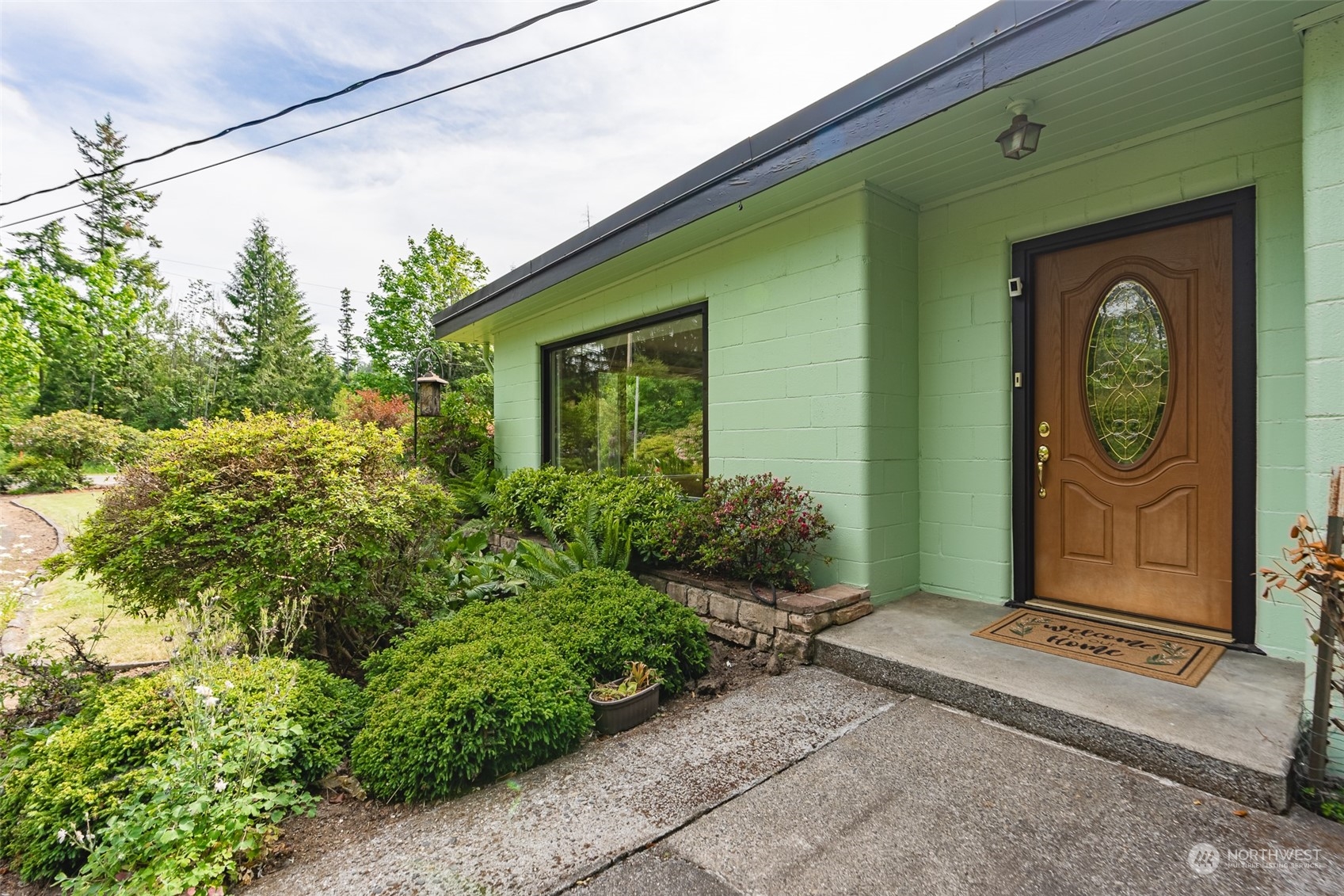 3326 Cedarville Road Bellingham, WA 98226 - Photo 3 of 40 a front view of a house with garden