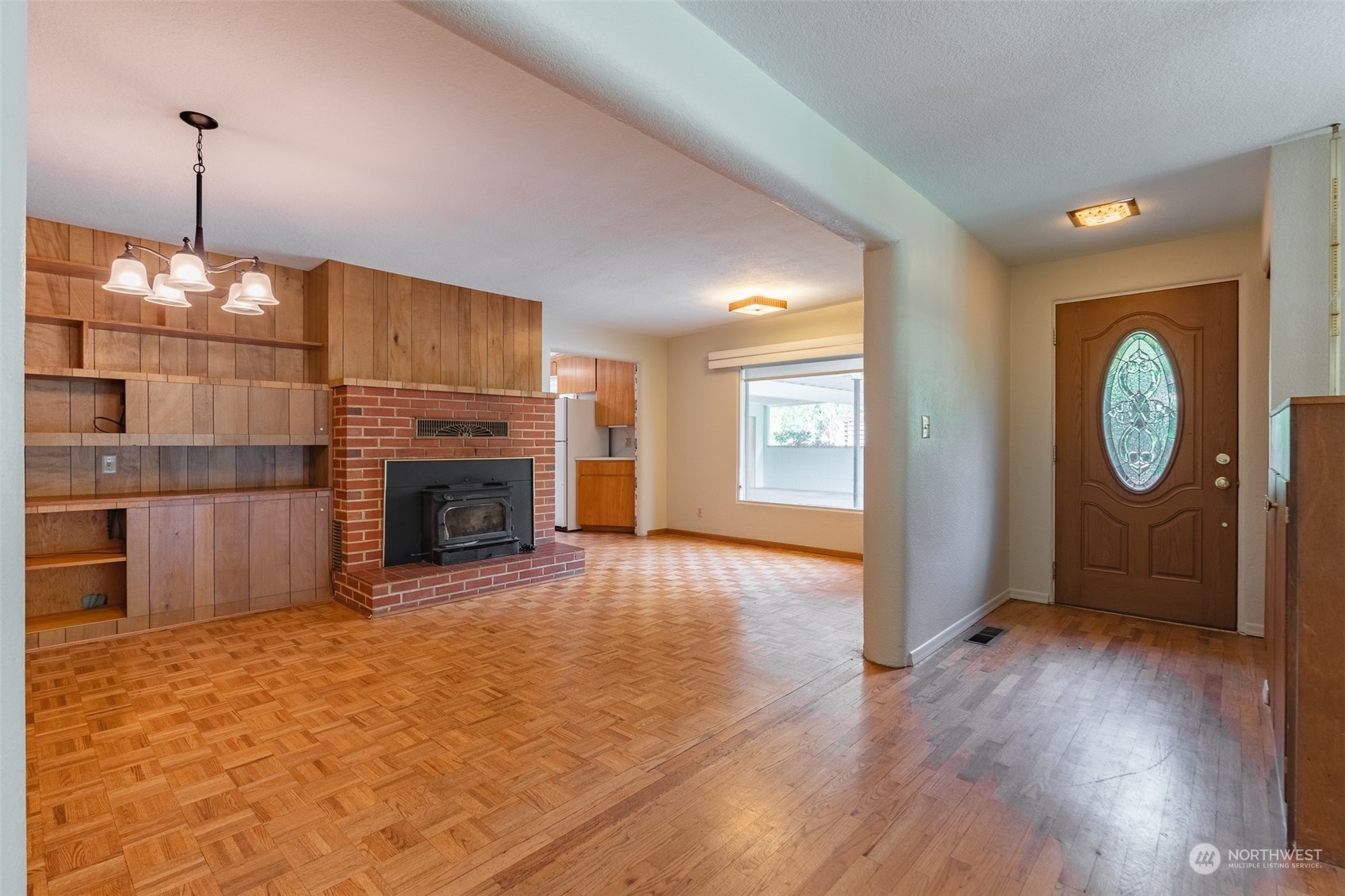 3326 Cedarville Road Bellingham, WA 98226 - Photo 7 of 40 a view of a livingroom with a fireplace a ceiling fan and window