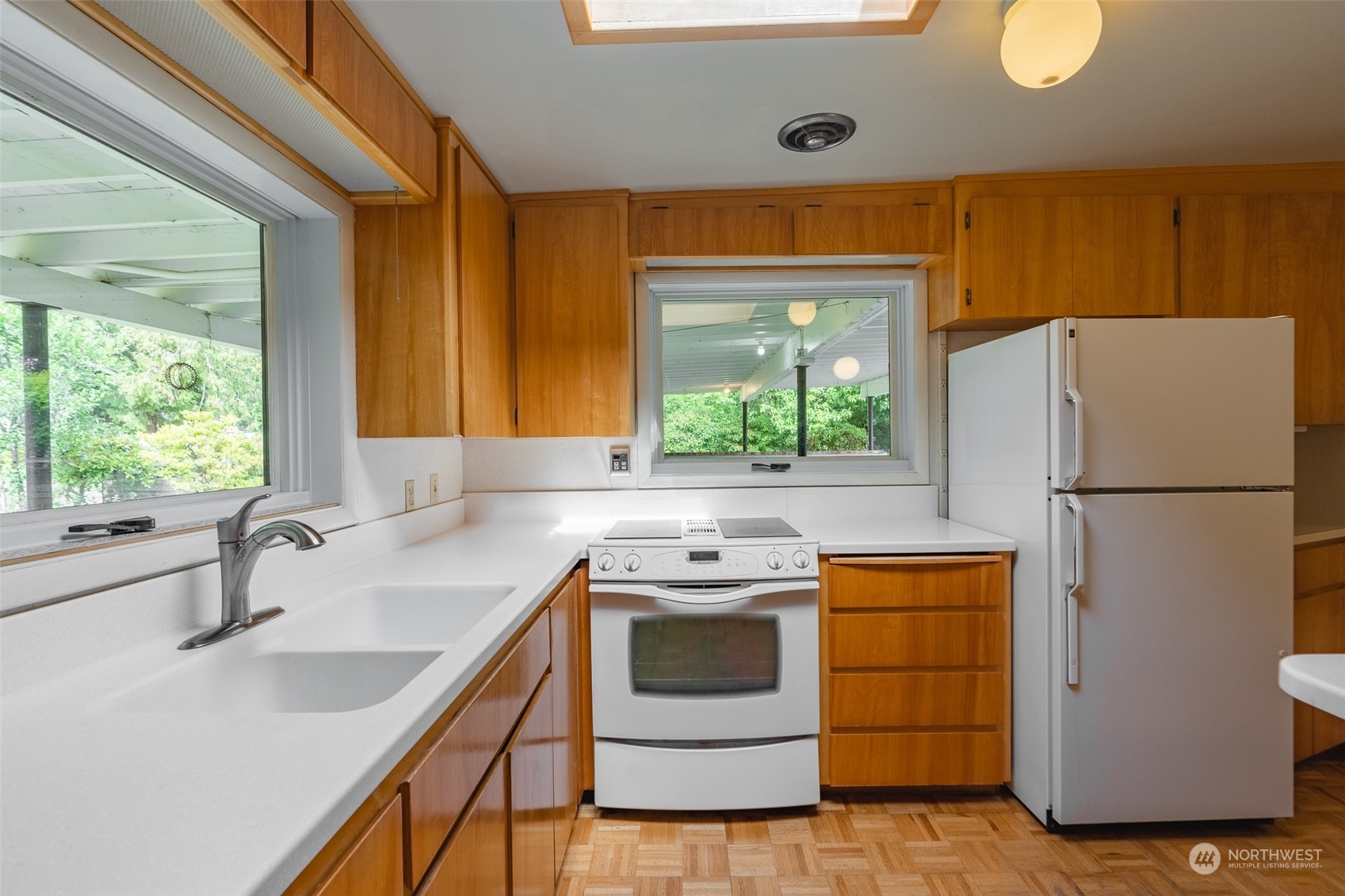3326 Cedarville Road Bellingham, WA 98226 - Photo 8 of 40 a kitchen with a sink cabinets stainless steel appliances and a window