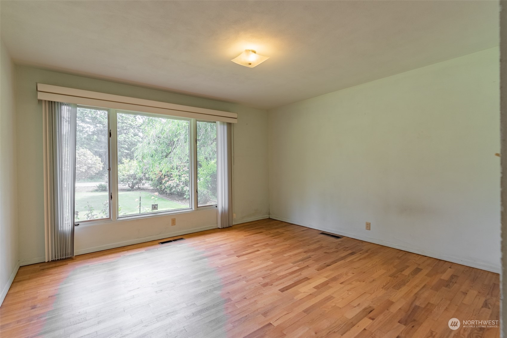 3326 Cedarville Road Bellingham, WA 98226 - Photo 10 of 40 an empty room with wooden floor and windows