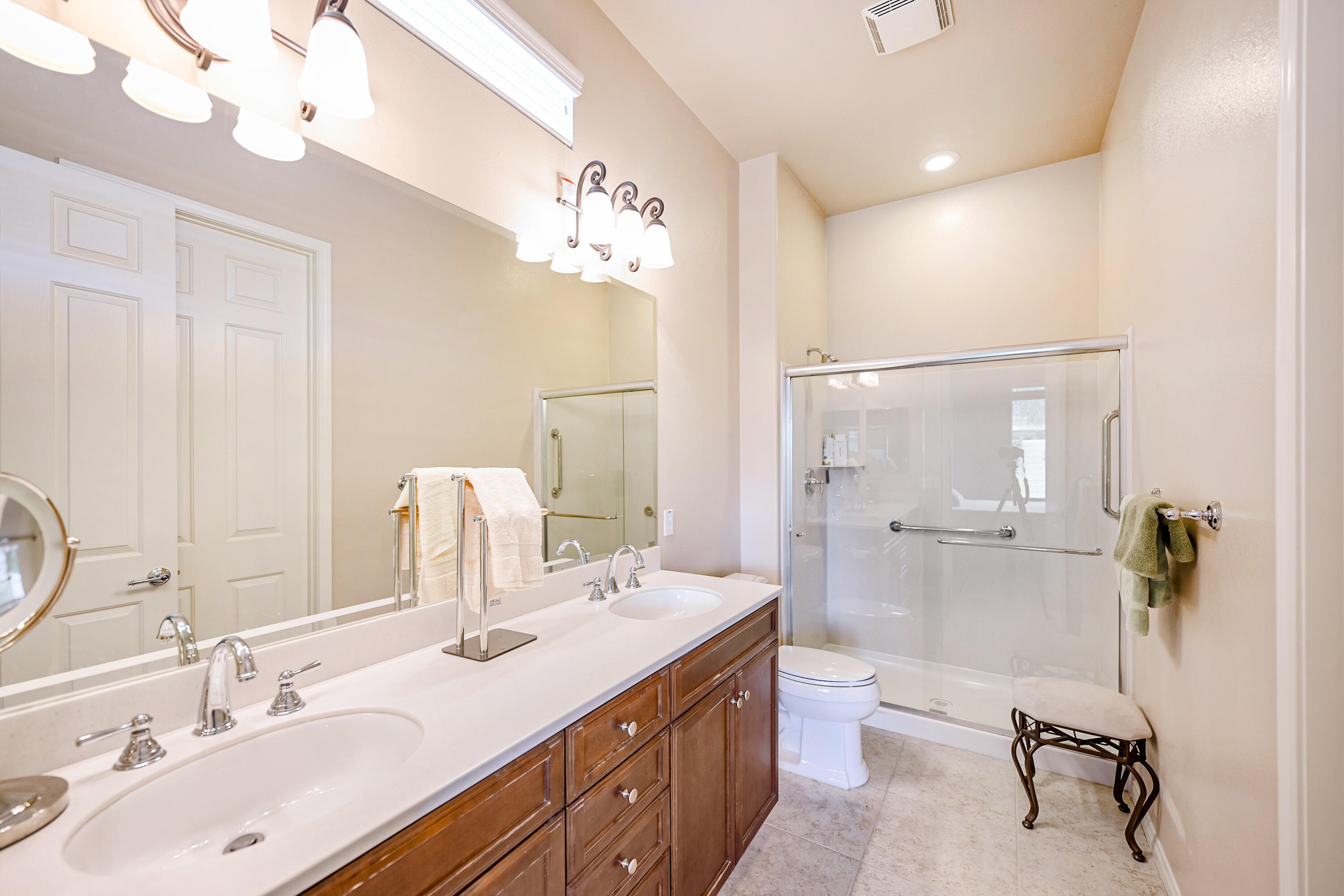 81674 Avenida Celaya Indio, CA 92203 - Photo 16 of 43 a bathroom with a double vanity sink mirror and toilet