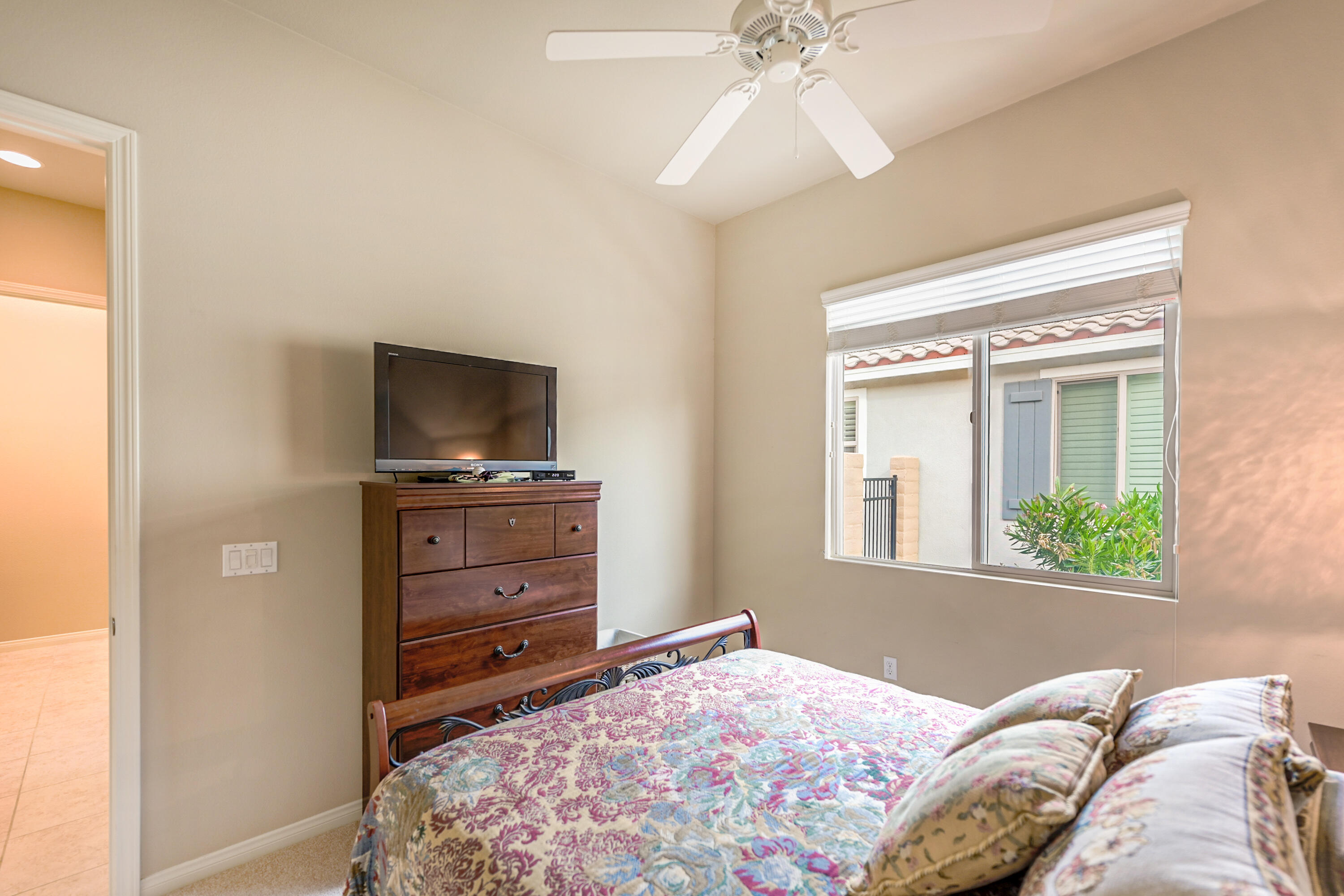 81674 Avenida Celaya Indio, CA 92203 - Photo 18 of 43 a bedroom with a bed and a television