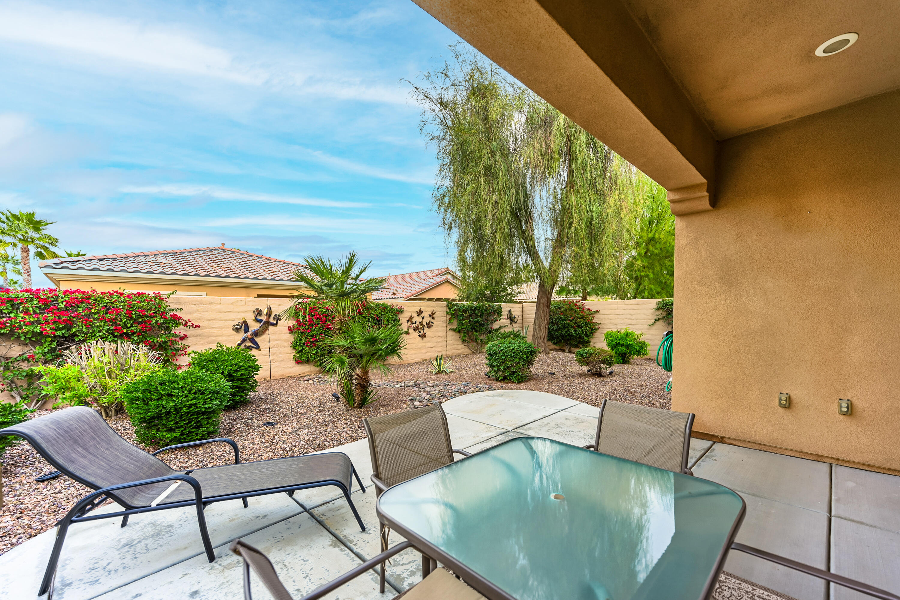 81674 Avenida Celaya Indio, CA 92203 - Photo 22 of 43 a view of a swimming pool with lawn chairs
