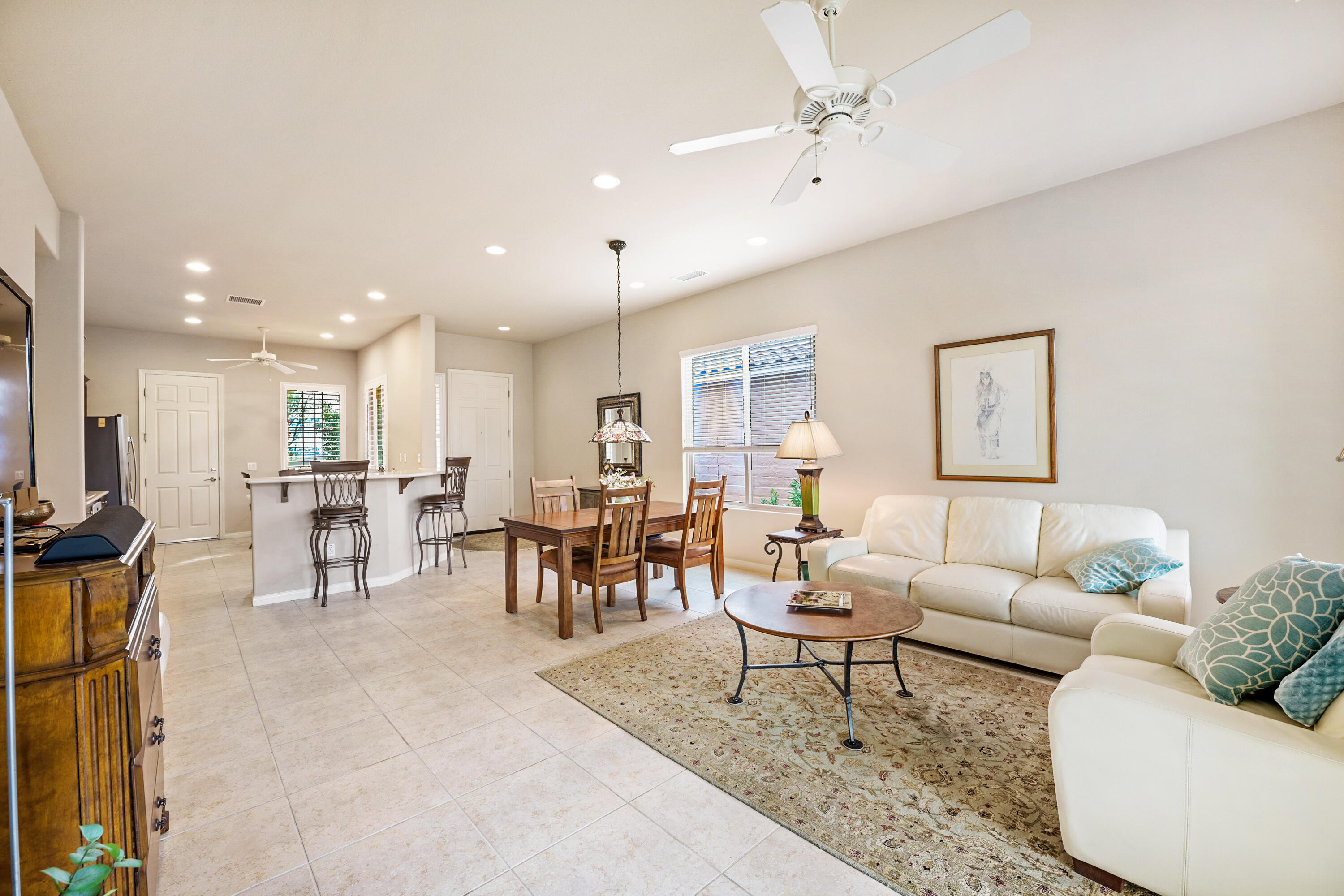 81674 Avenida Celaya Indio, CA 92203 - Photo 6 of 43 a living room with furniture and a table