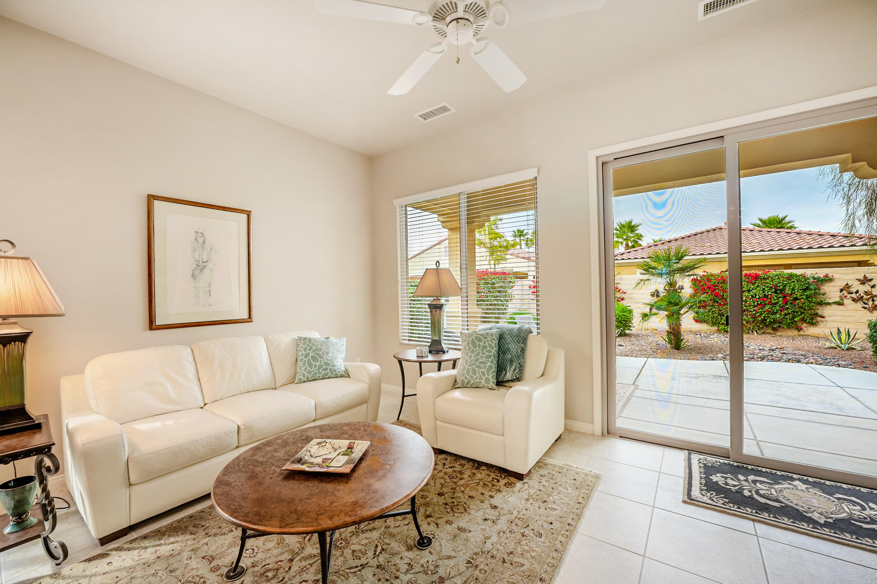 81674 Avenida Celaya Indio, CA 92203 - Photo 7 of 43 a living room with furniture and a large window