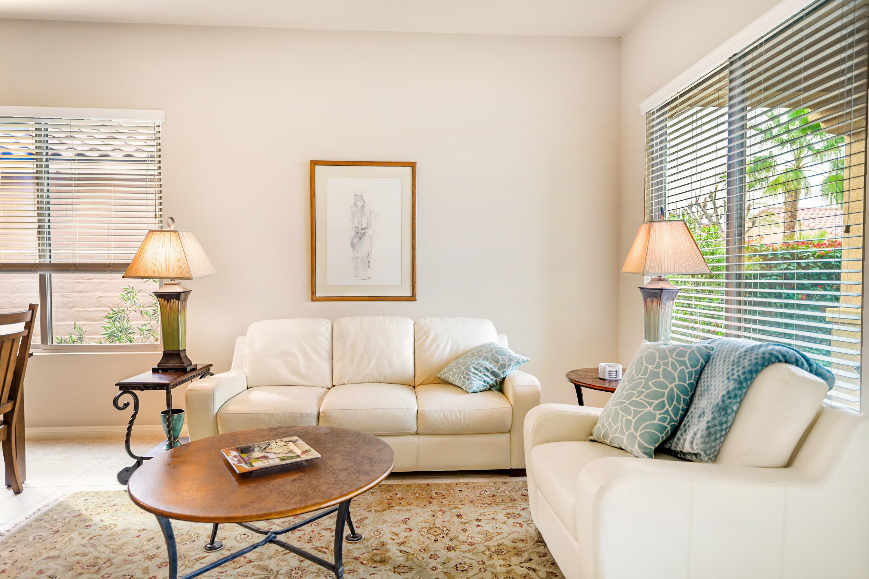 81674 Avenida Celaya Indio, CA 92203 - Photo 8 of 43 a living room with furniture and a lamp