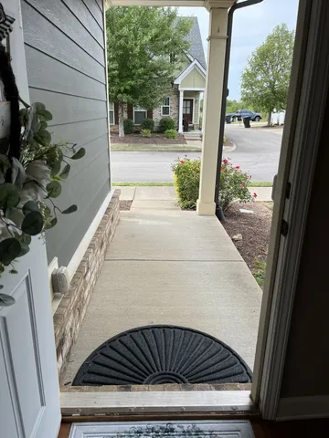 a view of a porch with furniture
