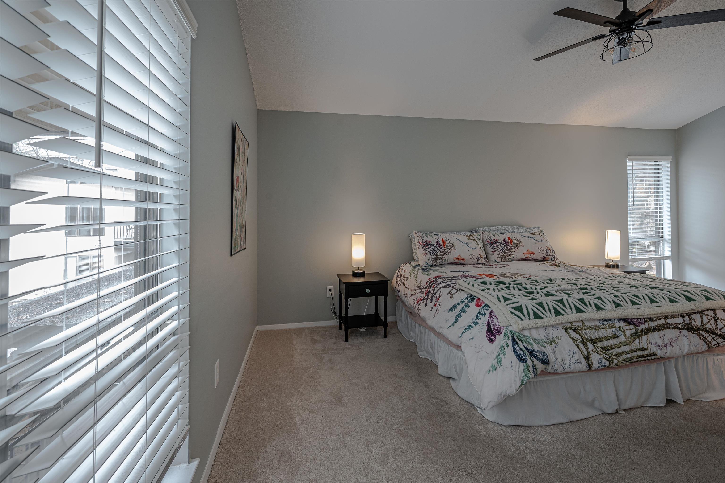 427 South Perkins Road, Unit 4272 Memphis, TN 38117 - Photo 15 of 29 a bedroom with a bed and a night stand
