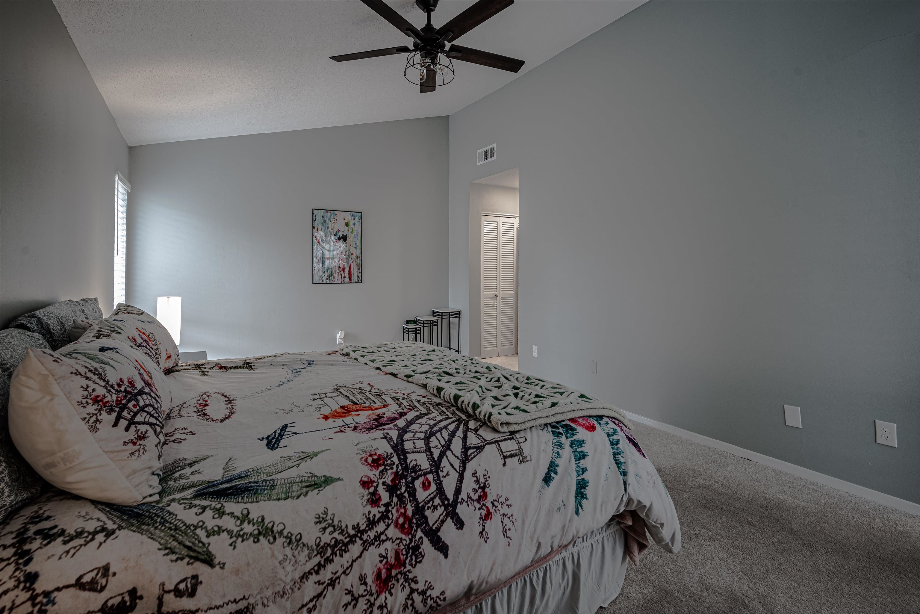 427 South Perkins Road, Unit 4272 Memphis, TN 38117 - Photo 16 of 29 a bedroom with a bed and a chandelier