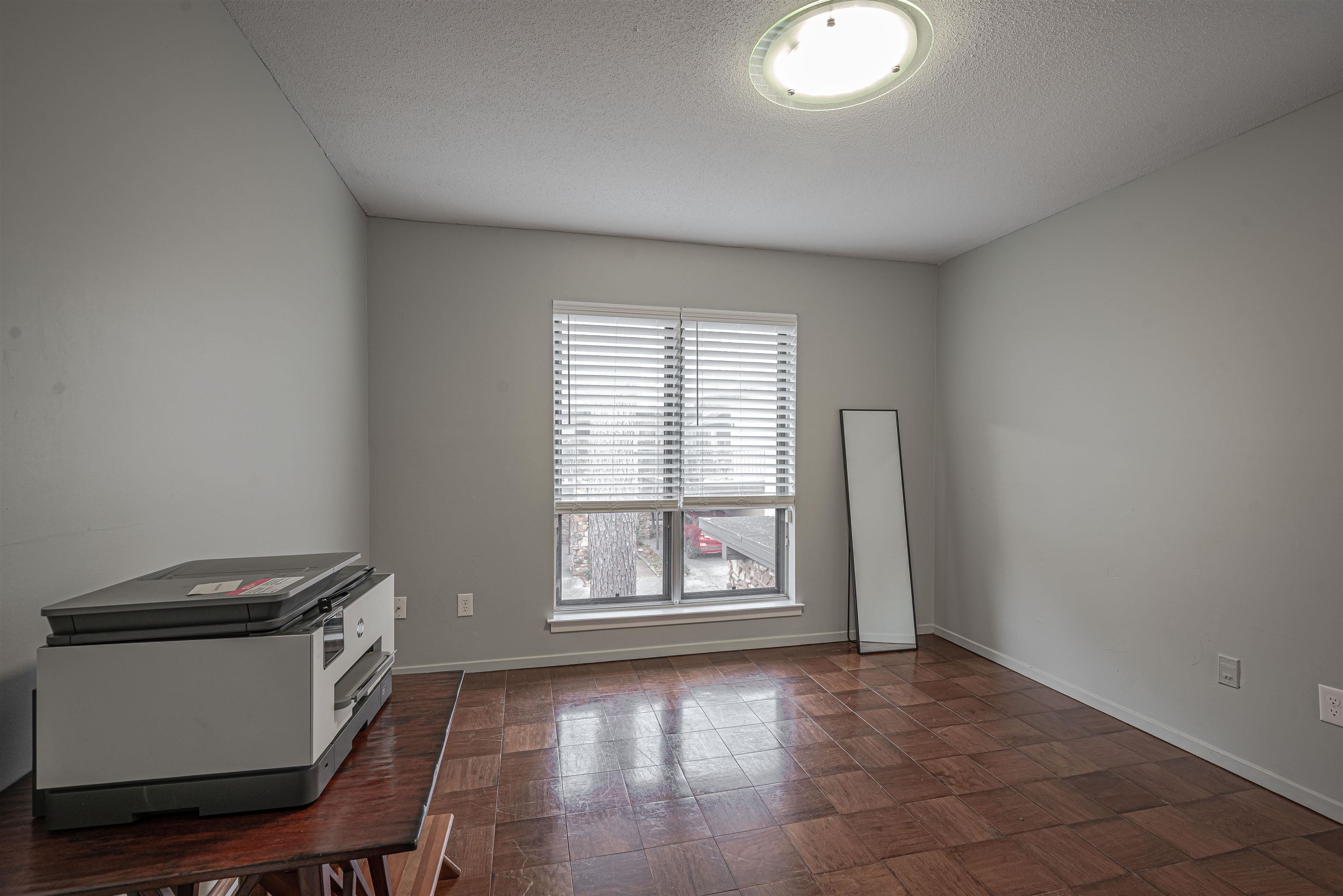 427 South Perkins Road, Unit 4272 Memphis, TN 38117 - Photo 22 of 29 a view of an empty room with a window and wooden floor