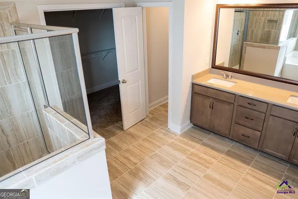 a view of a kitchen from the hallway