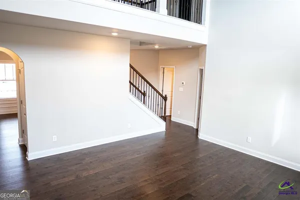 a view of an entryway with wooden floor