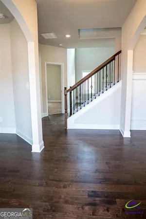 a view of entryway with wooden floor