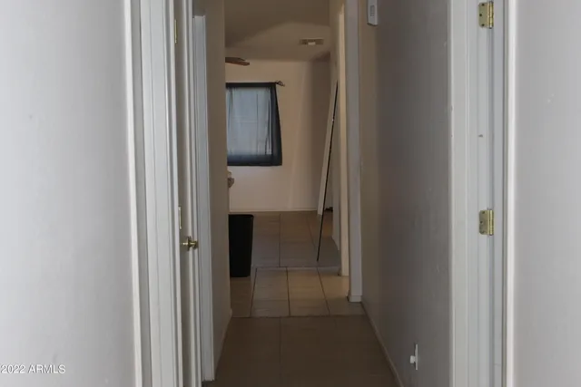 a view of a bathroom from a hallway