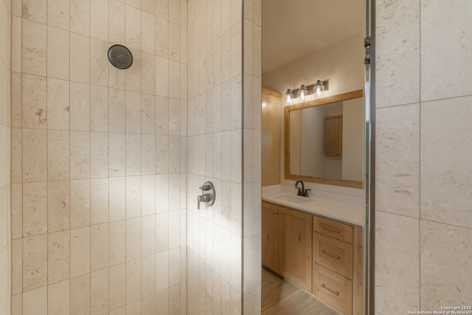 591 Eichman Road Poteet, TX 78065 - Photo 12 of 18 a bathroom with a sink shower and a mirror