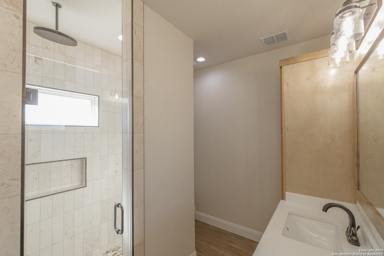 591 Eichman Road Poteet, TX 78065 - Photo 13 of 18 a bathroom with a sink and shower