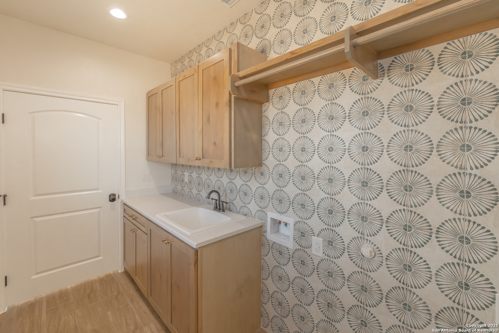 591 Eichman Road Poteet, TX 78065 - Photo 14 of 18 a bathroom with a sink and a mirror