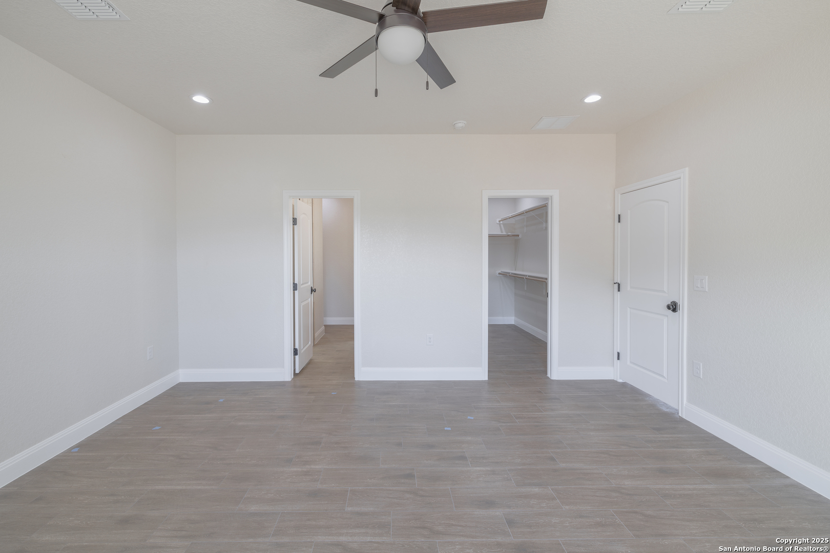 591 Eichman Road Poteet, TX 78065 - Photo 15 of 18 an empty room with chandelier fan and entryway