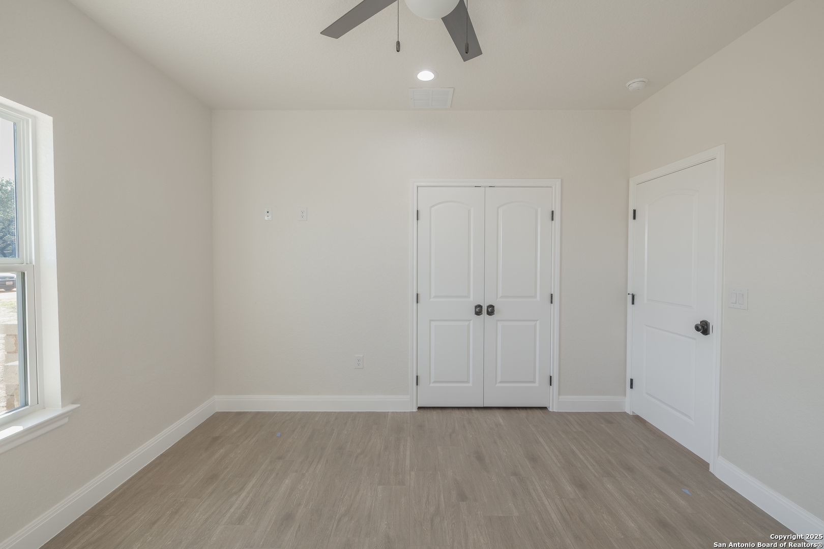 591 Eichman Road Poteet, TX 78065 - Photo 16 of 18 a view of an empty room with a window