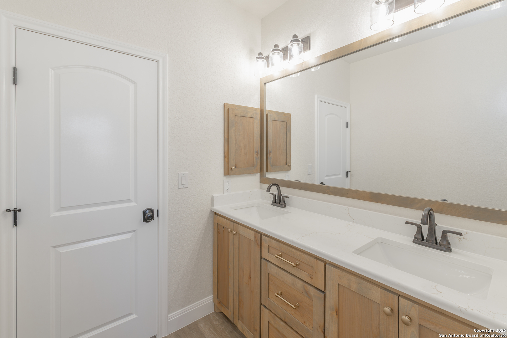 591 Eichman Road Poteet, TX 78065 - Photo 18 of 18 a bathroom with a sink and a mirror