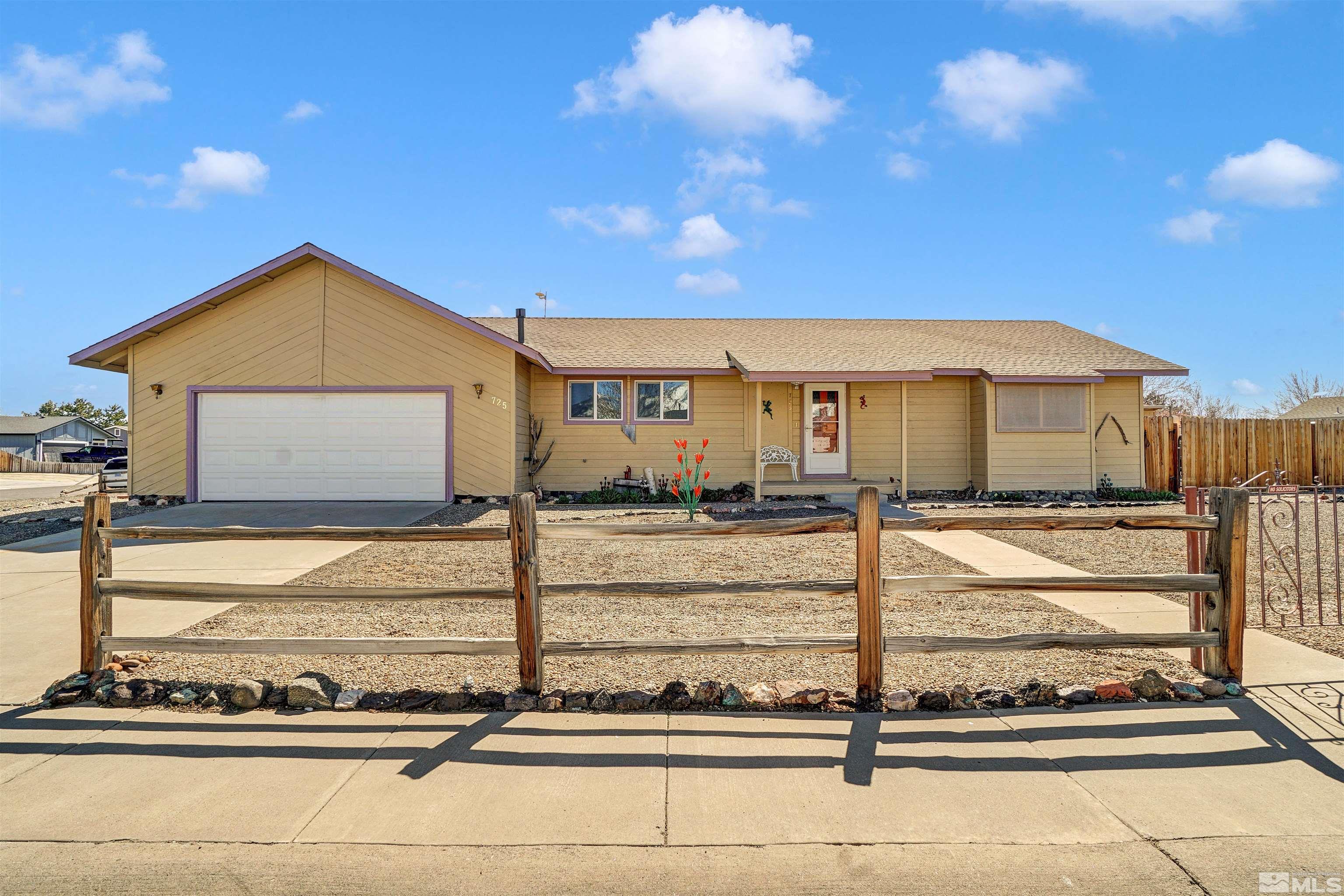 725 Addler Road Gardnerville, NV 89460 - Photo 1 of 24 a view of a house with wooden fence