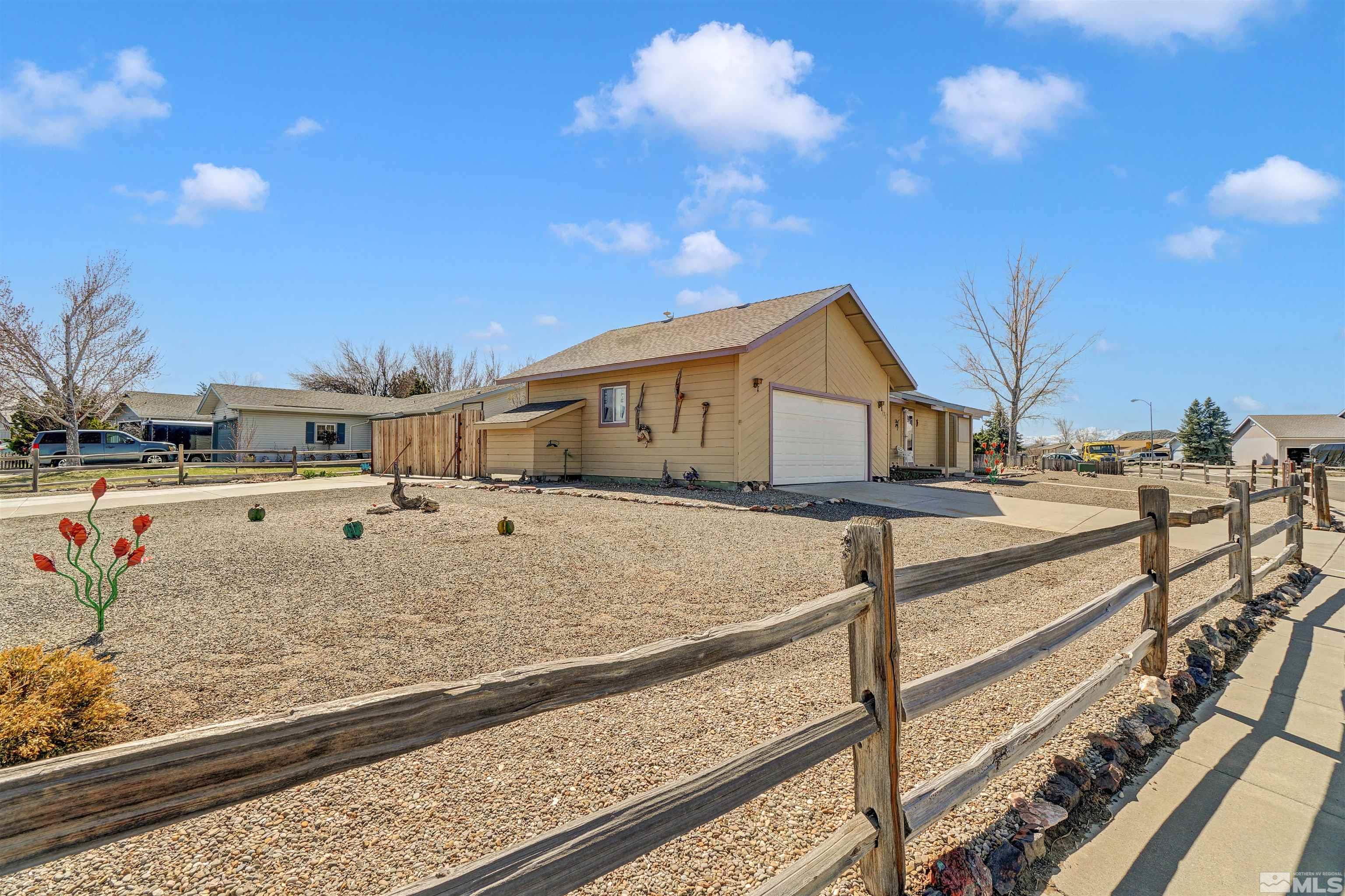 725 Addler Road Gardnerville, NV 89460 - Photo 3 of 24 a view of a house with a yard