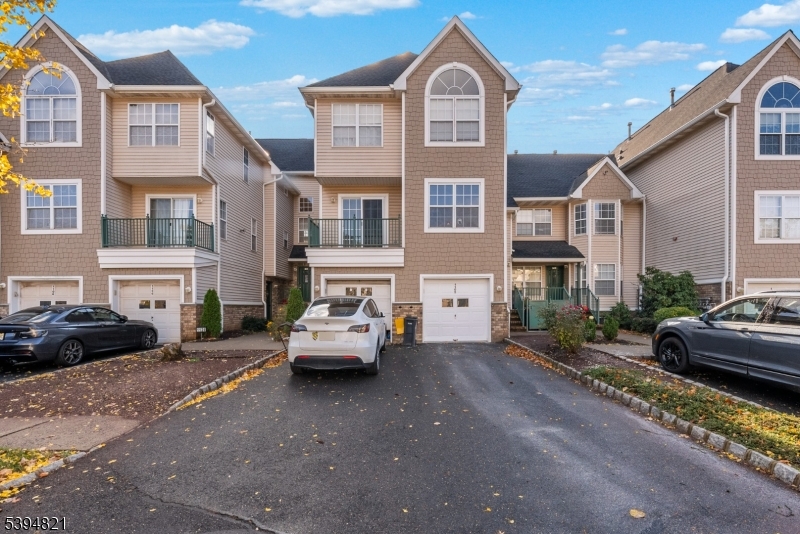 a car parked in front of a brick house