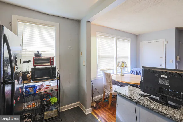 a workspace with furniture and a window