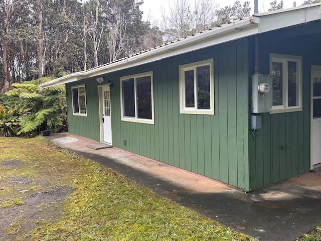 11-3791 4th Street Volcano, HI 96785 - Photo 7 of 16 a view of an house with backyard and garden