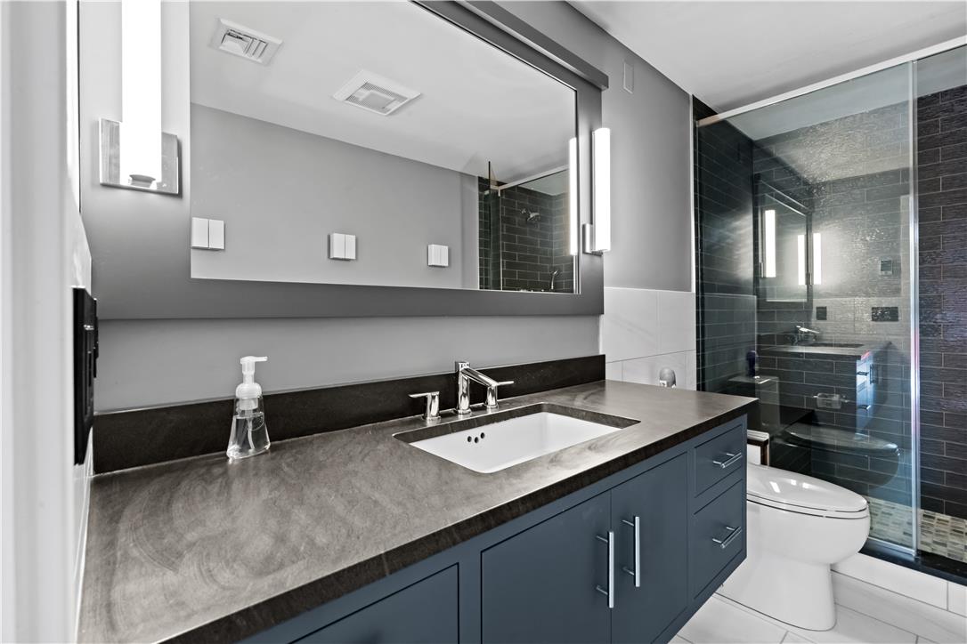 1506 Pleasant View Road Coopersburg, PA 18036 - Photo 71 of 97 A well-appointed bathroom features a sleek vanity, modern fixtures, and a spacious glass-enclosed shower.